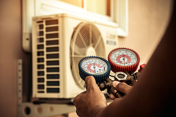 Professional Air Conditioning Service technician working in Nutting Lake, MA